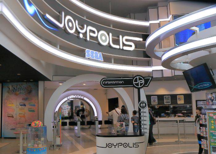 The SEGA Joypolis entrance, showing off a minimalist, futuristic design and logo.