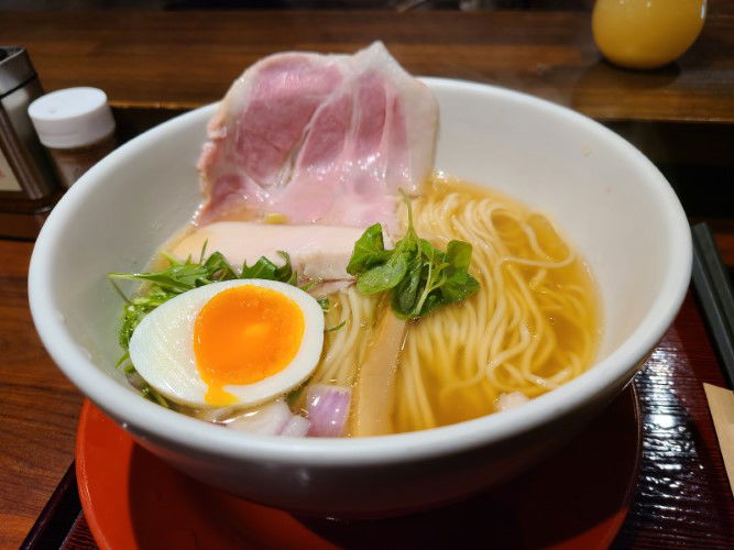 The golden-hued ramen of Kobushi Ramen, combining duck and blackthroat sea perch for a unique flavor.