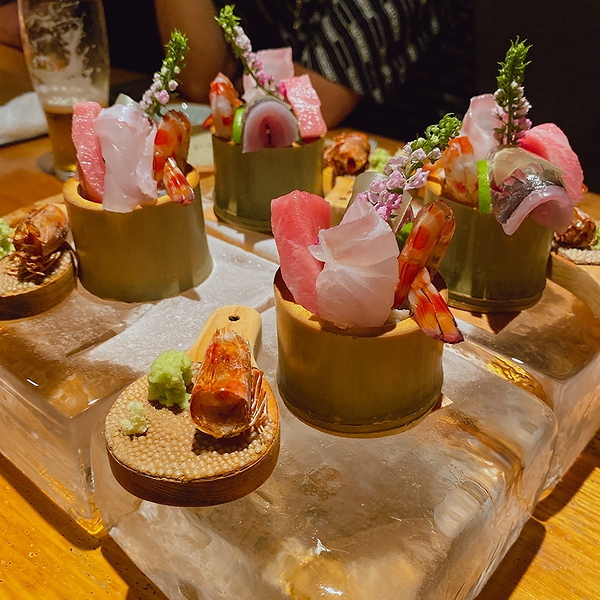Exquisite sushi and seafood platter on decorative ice block