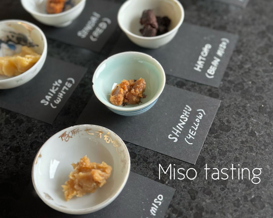 A variety of different miso pastes, labeled by type.