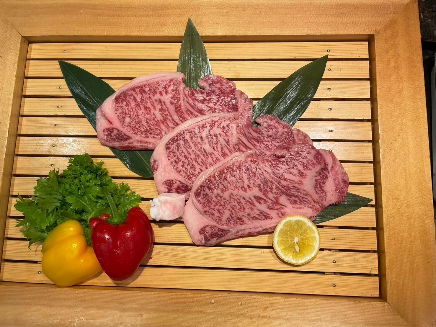 Three slices of wagyu laid out and ready for cooking in this unique Osaka cooking class.