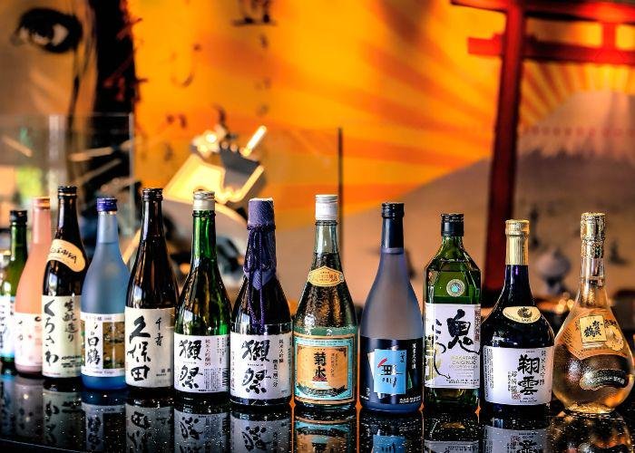 numerous bottles of Japanese sake