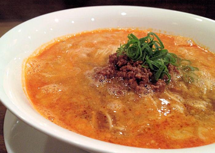 Dandan noodles from Nakiryu, a Michelin-starred ramen restaurant. Spicy orange broth with ground meat and scallions. 