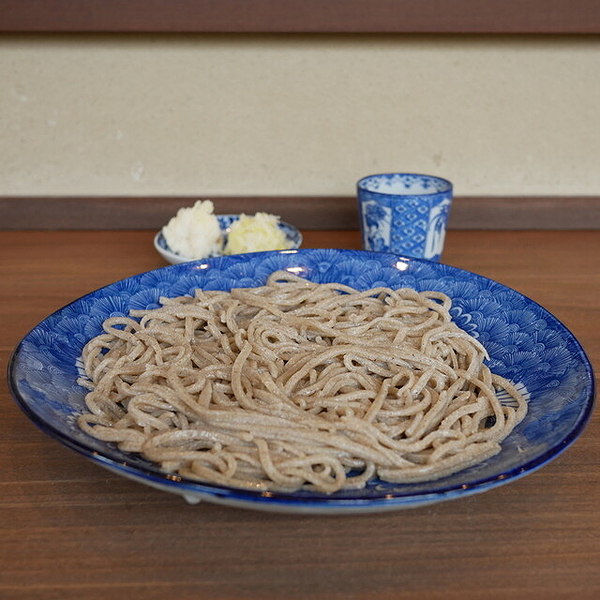 Traditional Japanese soba noodles in blue dish
