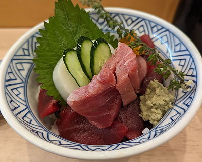 Fresh sashimi platter featuring tuna and cucumber slices