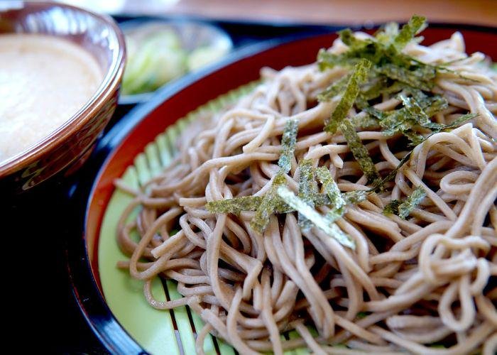 Zaru soba, a type of cold soba noodles on a bamboo basket, with nori flakes