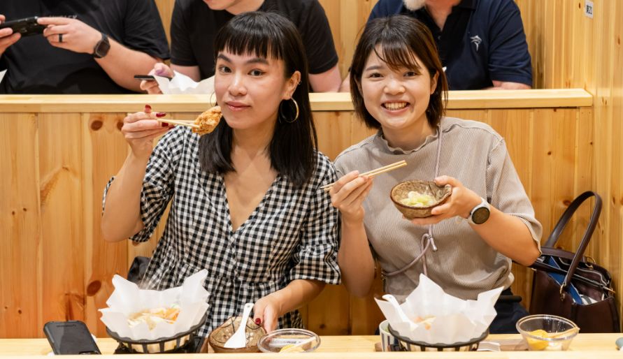 Two byFooders enjoying food at the Asakusa sumo experience.