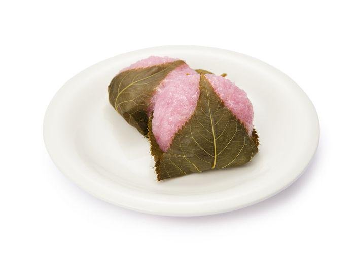 Sakura mochi, pink-colored sweet pounded rice cake wrapped in a leaf