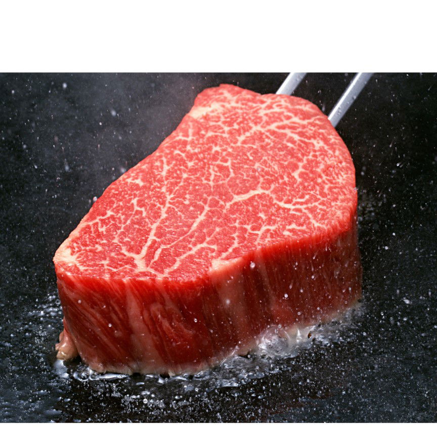 Juicy Wagyu steak on grill for gourmet dining experience