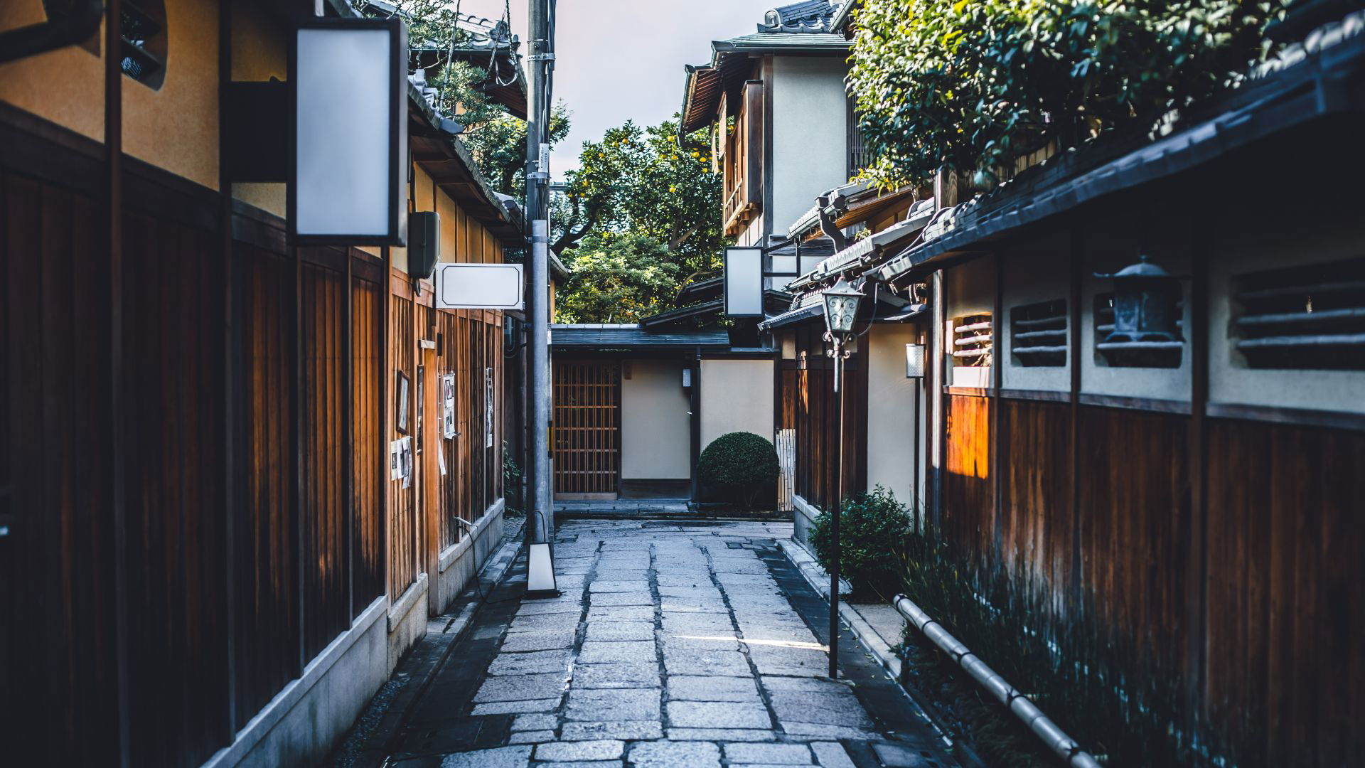 Traditional Japanese street with wooden houses and stone pathway