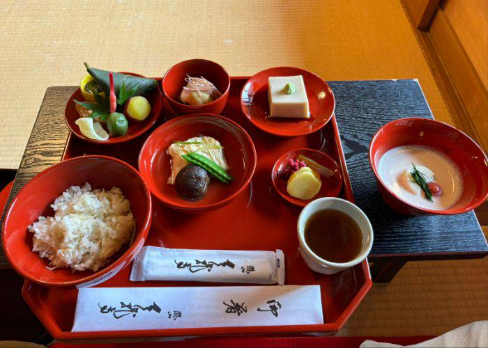 A traditional shojin ryori multi-course meal at Shigetsu, served in the traditional red lacquerware.