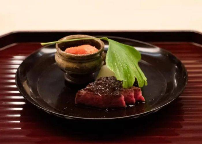 An elegant plating of premium meat at Mizuno.