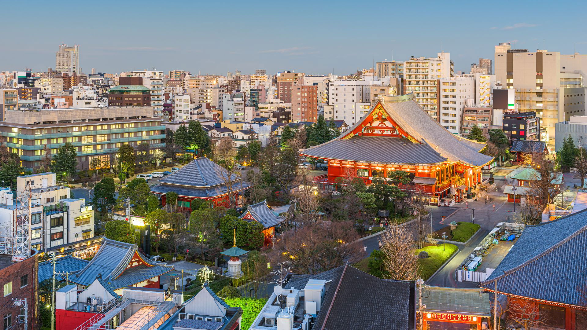 Tokyo skyline with historic Senso-ji Temple at sunset