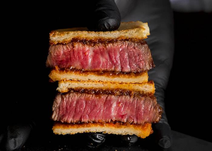 A thick, juicy wagyu beef sandwich at Yakiniku Ushi Jirushi Shinjuku.