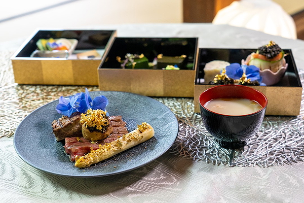 Elegant gourmet dining with bento boxes and exquisite plating