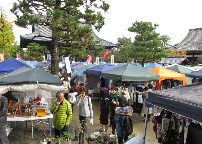 Several stalls of clothing, crafts, food, and other foods, are set uo outside Chion-ji Handicraft Market in Kyoto