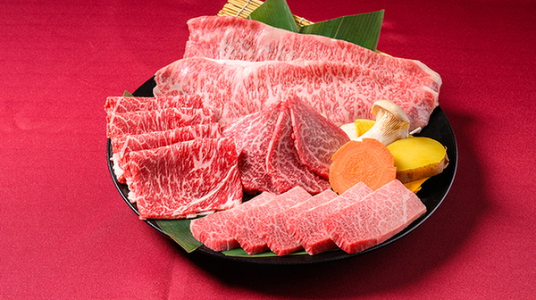 Premium marbled beef slices with vegetables on a platter