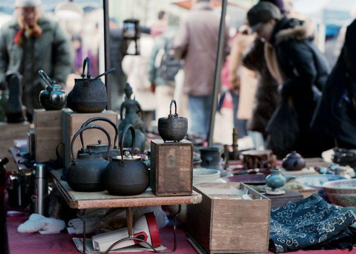 Iron kettles displayed for sale at a market at Toji Temple in Kyoto 