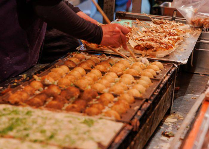 A street food stall serving up takoyaki octopus balls.