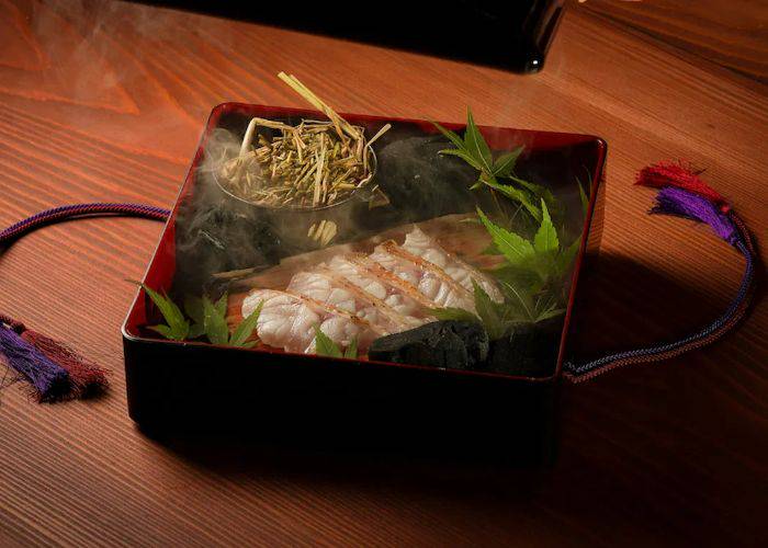 A picturesque serving at CRAFEAT, presented in a traditional lacquerware box.