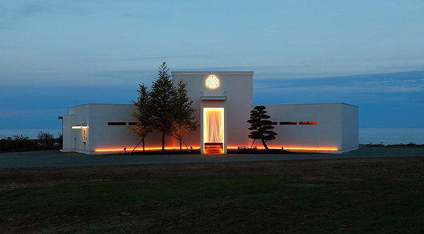 Modern restaurant exterior with evening lighting