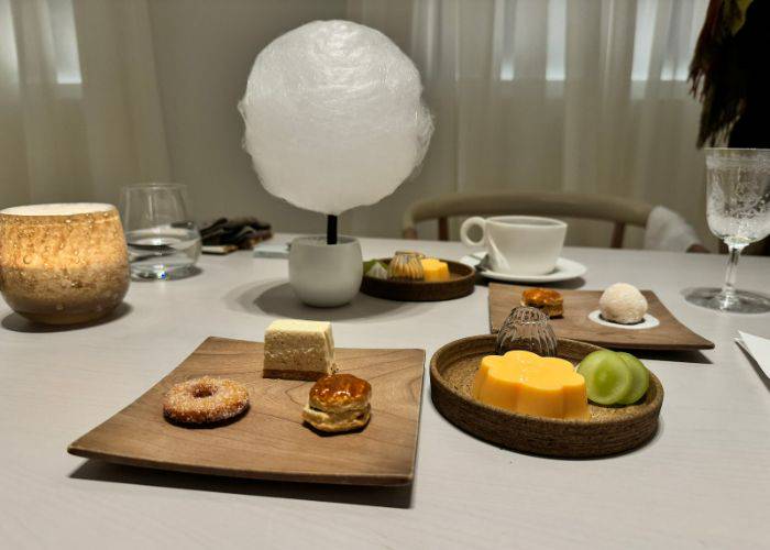 The dessert course at Reminiscence, featuring a selection of picturesque sweets on stylish plates.