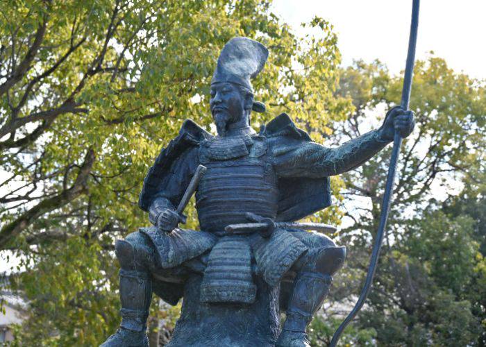 A statue honoring the famous feudal ruler Nobunaga Oda, immortalized in bronze.