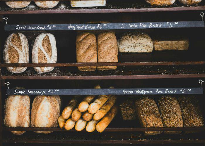 The shelves at a Western bakery, featuring baguettes, sourdough and multigrain bread.