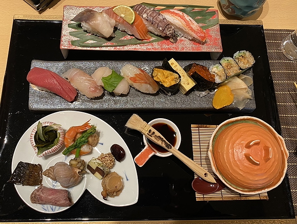 Elegant sushi and sashimi platter with traditional Japanese dishes