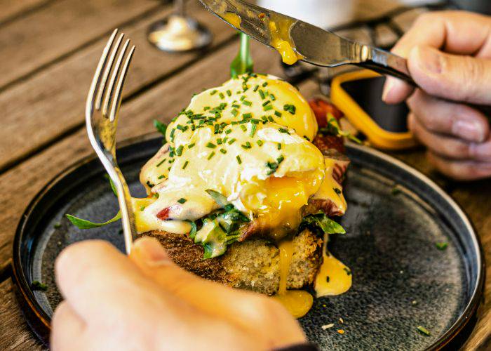 A classic brunch dish: Eggs Benedict, featuring a runny poached egg.