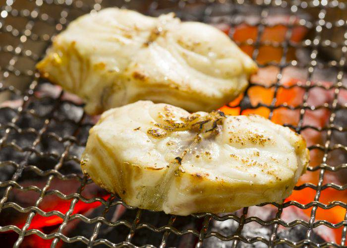 Sumibiyaki fugu, featuring puffer fish grilling over charcoal.