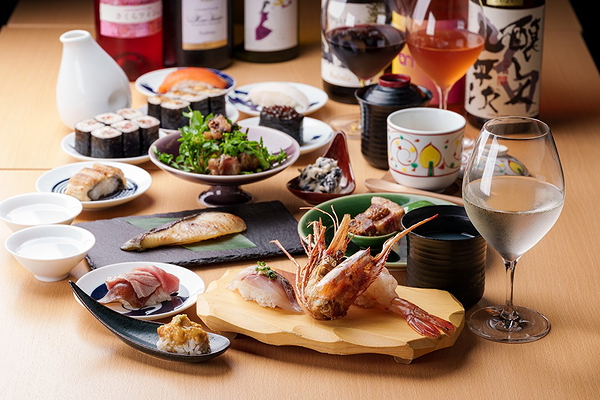 Elegant restaurant showcase with sushi, wine, and gourmet dishes