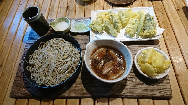 Traditional Japanese soba noodles with tempura and dipping sauce