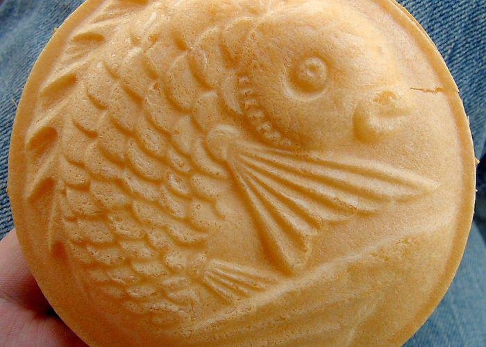 An ice cream wafer with an in print of a fish