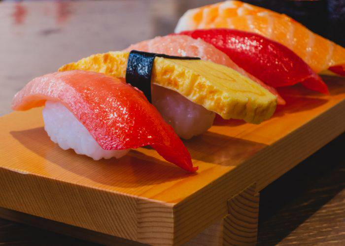 Fake Japanese sushi on a wooden block.