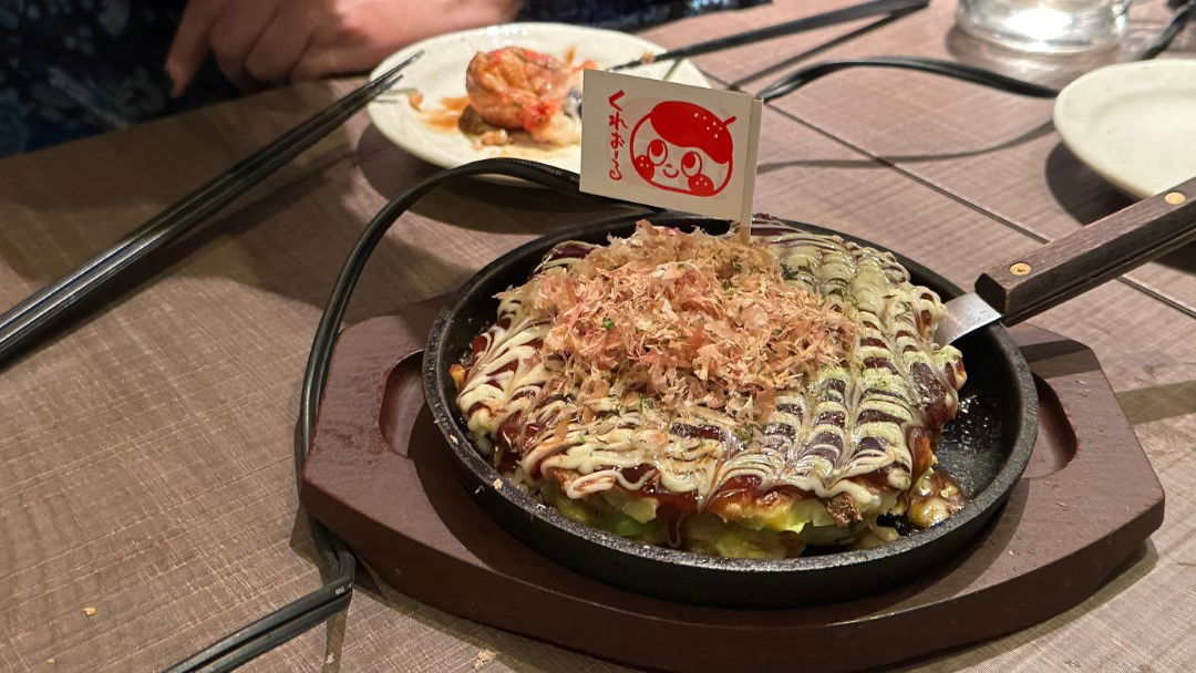 Okonomiyaki served up ready to go in this family-friendly night in Shibuya.