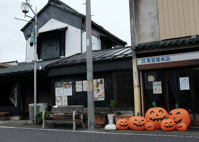 Inflatable pumpkins lining the street of Japan during Halloween season.