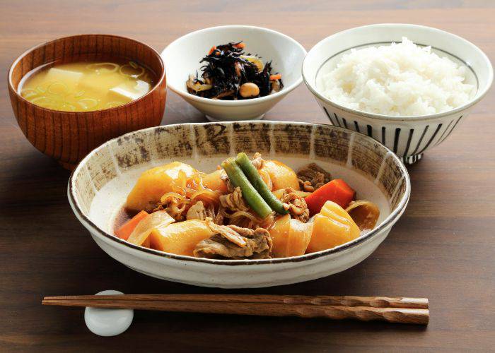 A set meal of nikujaga (meat and potato) with miso soup and more.