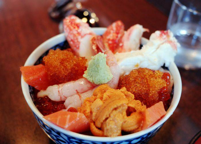 A vivid kaisendon seafood bowl, filled with all kinds of Japanese seafood ingredients.