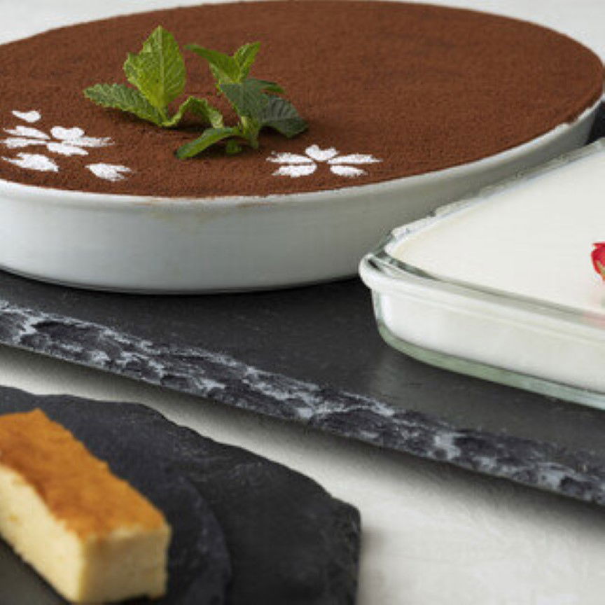 Delicious tiramisu dessert beautifully plated with mint garnish
