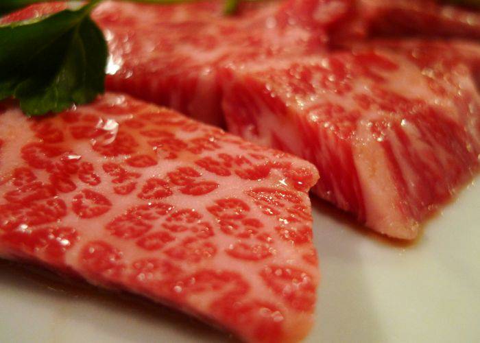 Glossy, marbled cuts of wagyu beef.