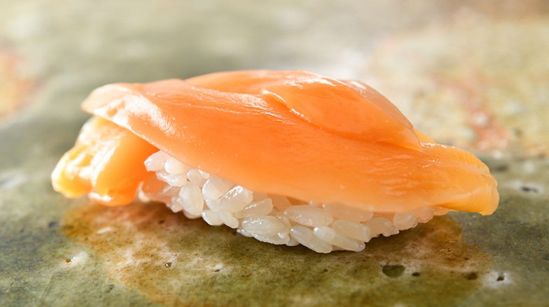 Nigiri sushi, pairing fresh fish with vinegared sushi rice.