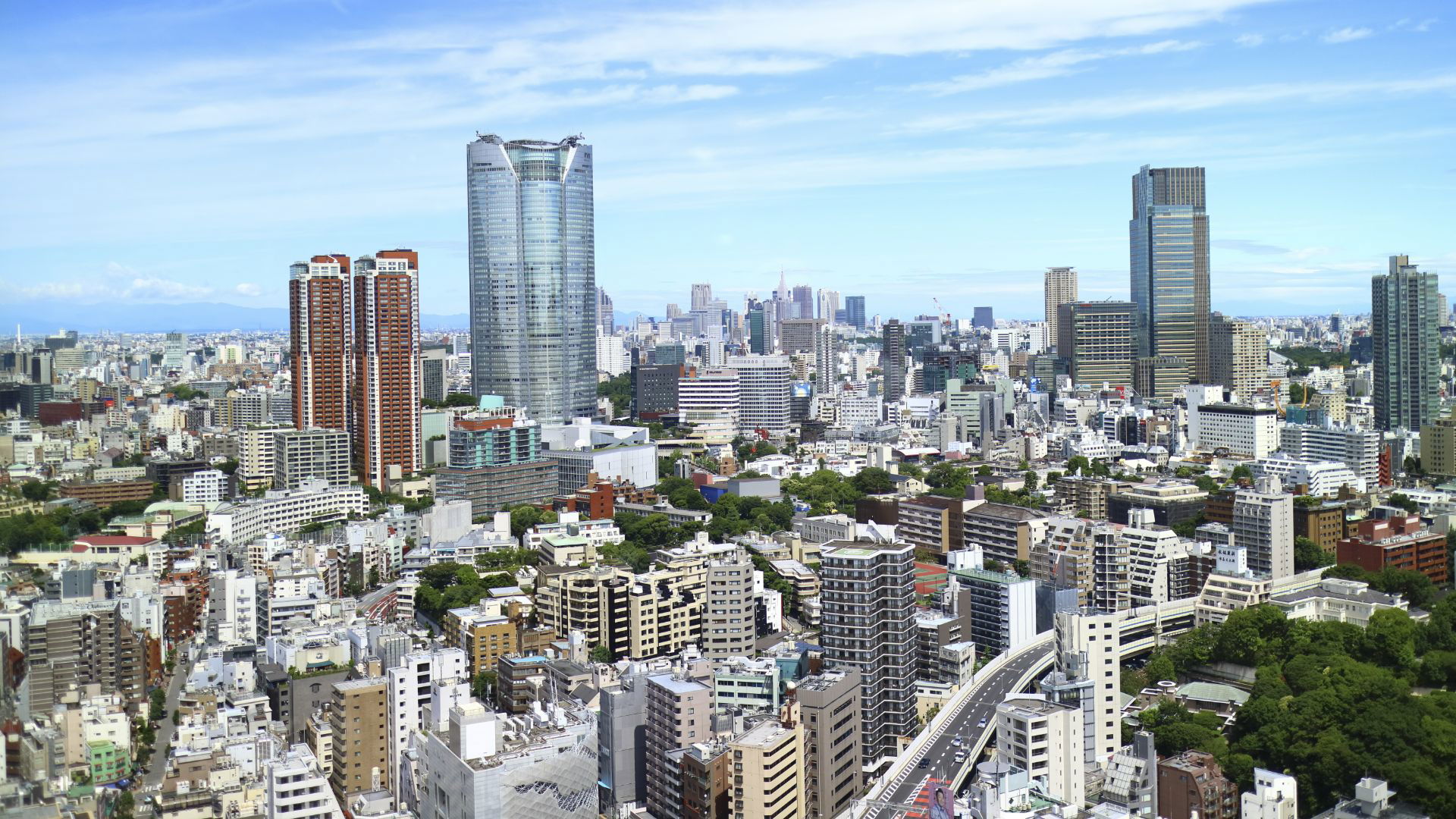 Tokyo skyline with modern skyscrapers and blue sky