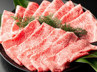 Premium Wagyu beef slices elegantly arranged on a black plate