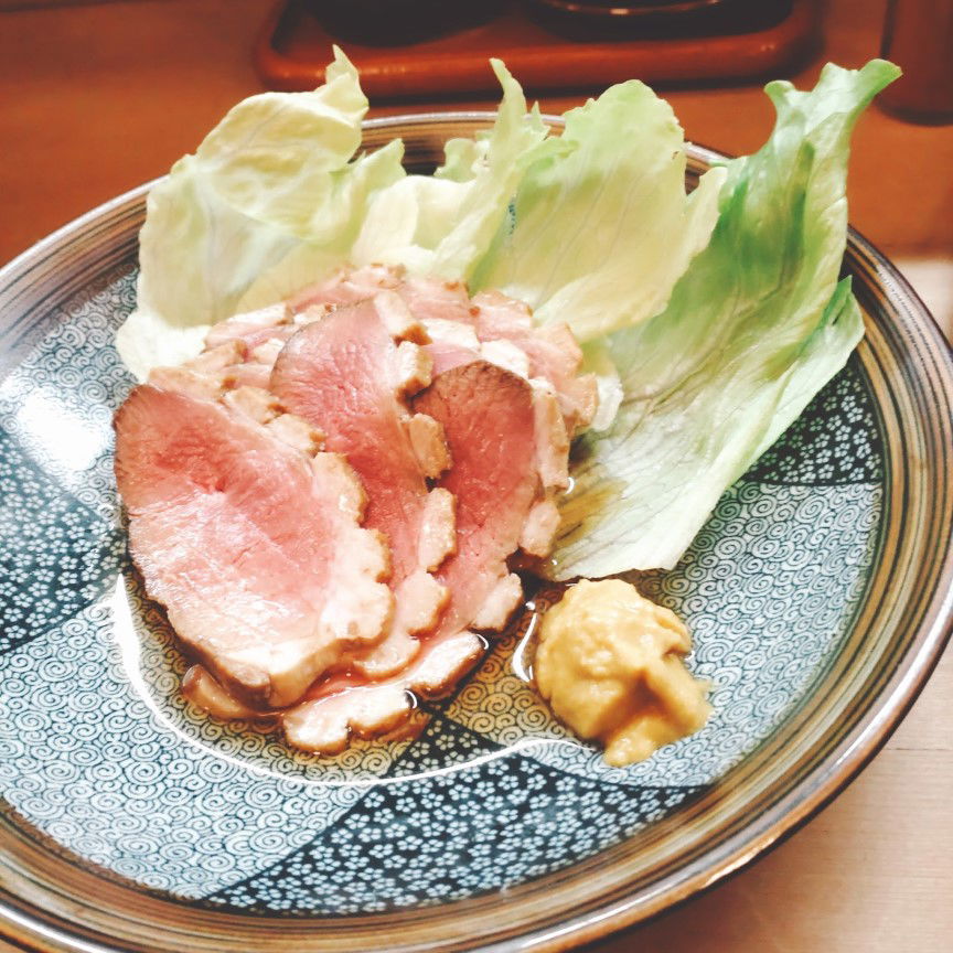 A dish of meat and fresh lettuce at Sushi Gen.