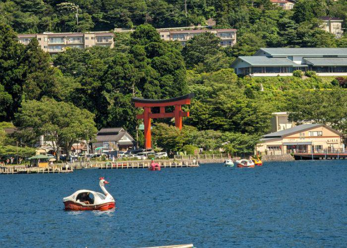 A swan-shaped pedal boat on the waters of Lake Ashi.