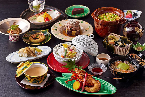 Elegant Japanese cuisine set with varied dishes and desserts