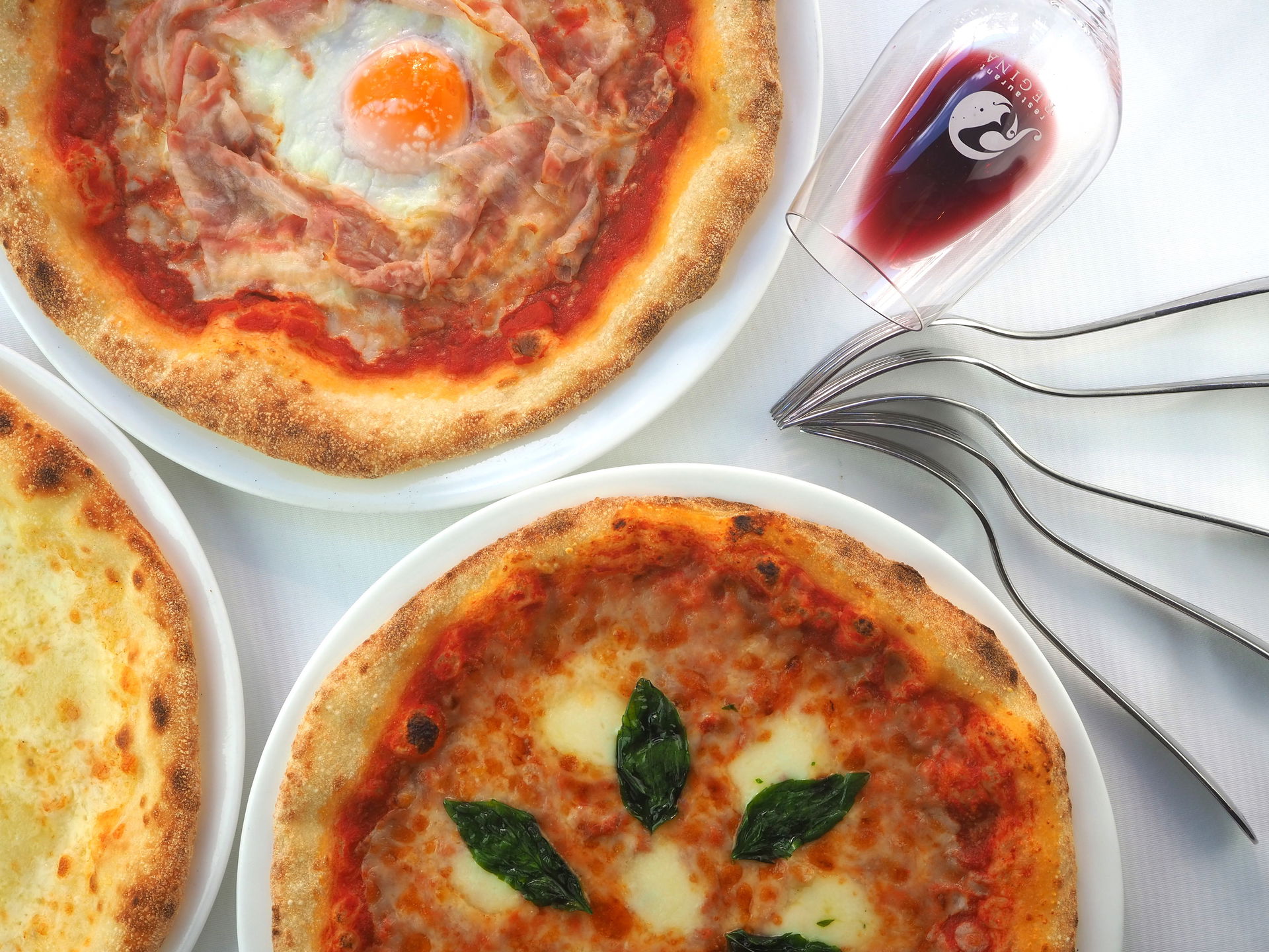 Gourmet pizza selection with wine pairing