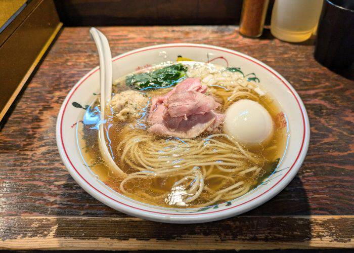 A unique portion of rare pork atop a bowl of ramen at Ramen Koike.