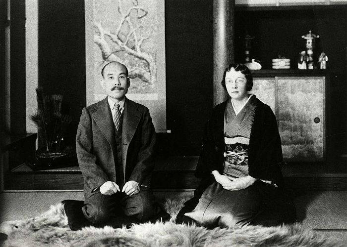 Masataka Taketsuru and his wife, kneeling seiza-style while staring at the camera.